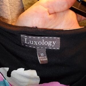 "Elegant Luxology women's size 10 black dress featuring a beautiful floral desig